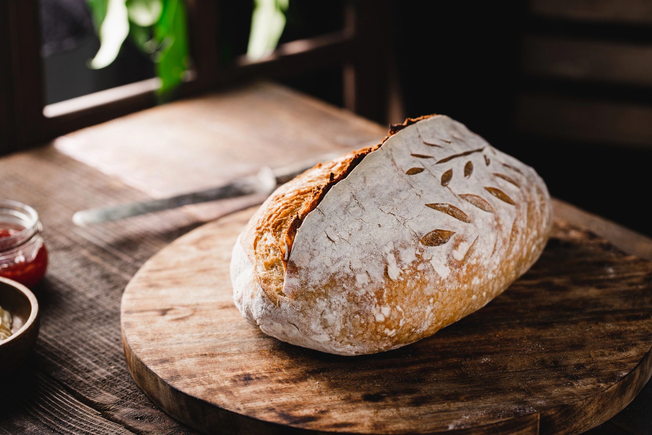 Freshly baked sourdough loaf on a wooden counter