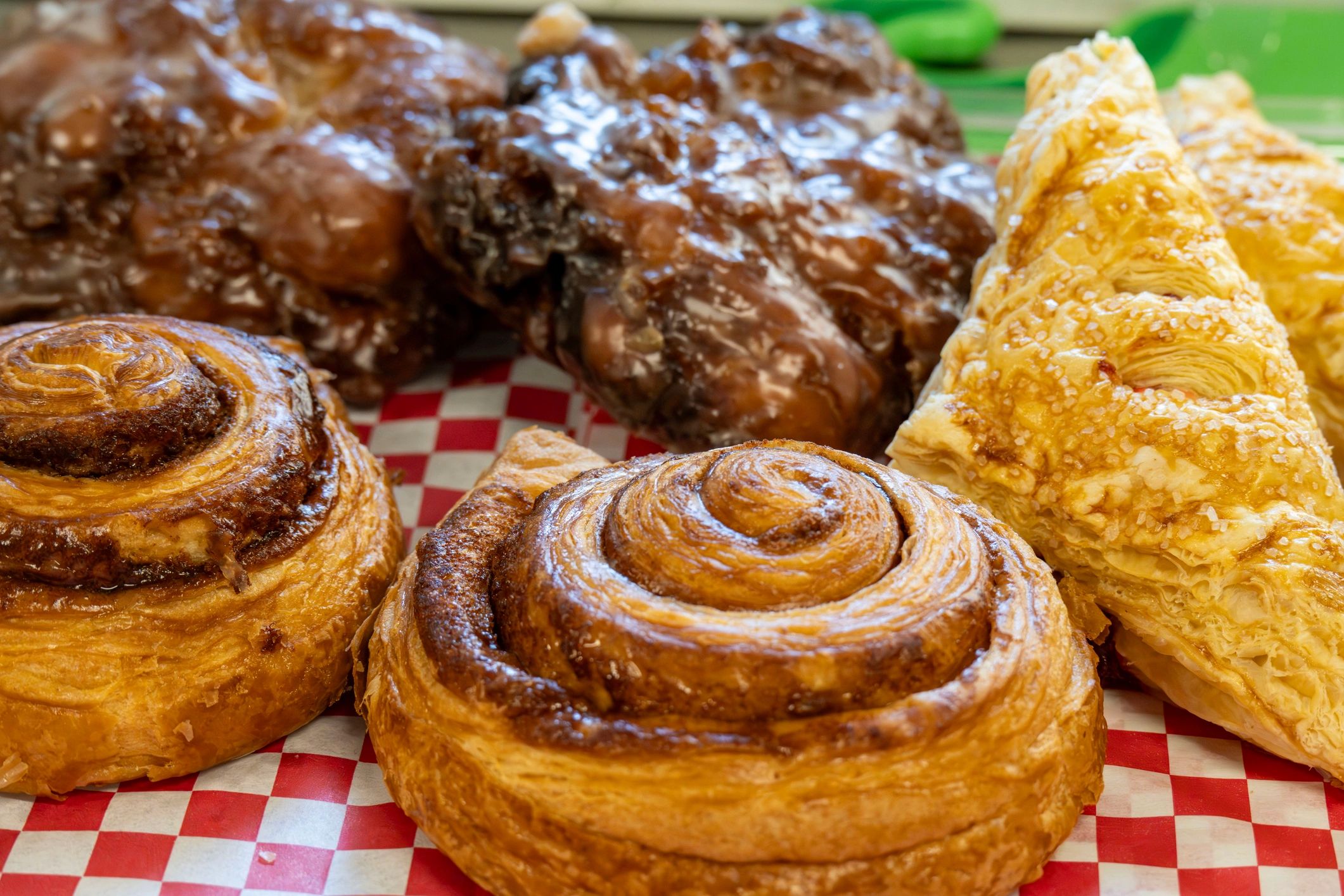 Assorted pastries including cinnamon rolls and turnovers